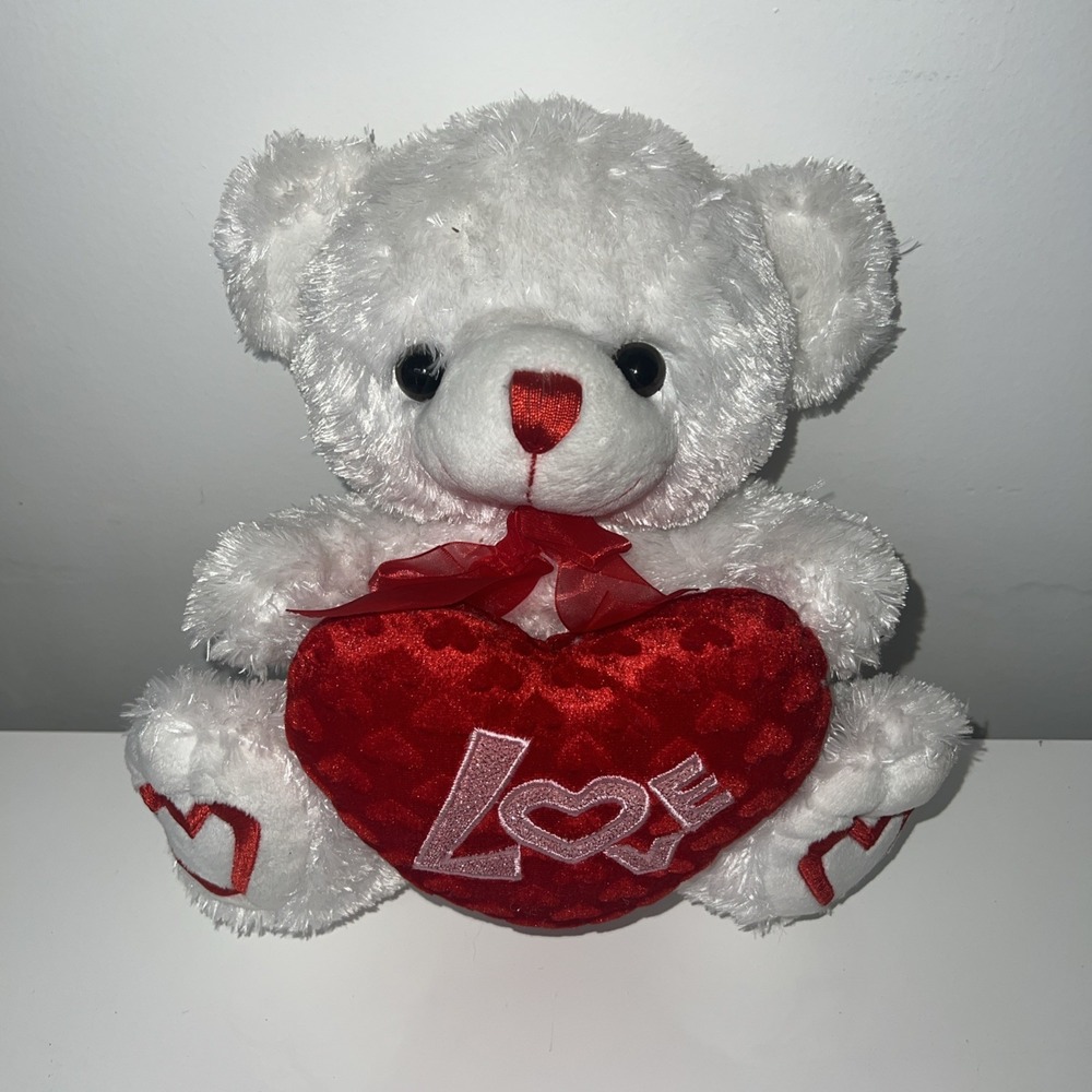3N32- This is a white Valentine's‎ Day plush teddy bear holding a red heart